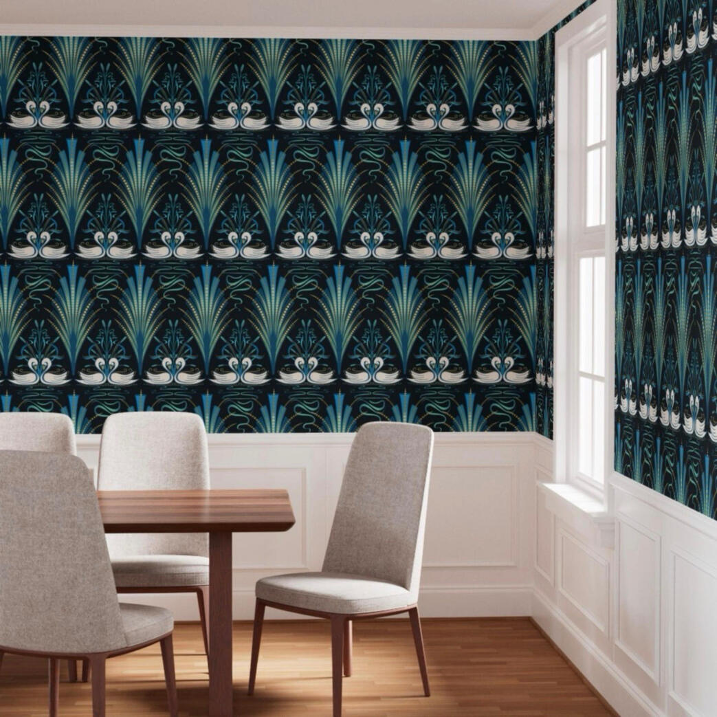 Teal and navy Art Deco swan wallpaper featured in a bright dining room with white wainscoting and modern upholstered chairs.