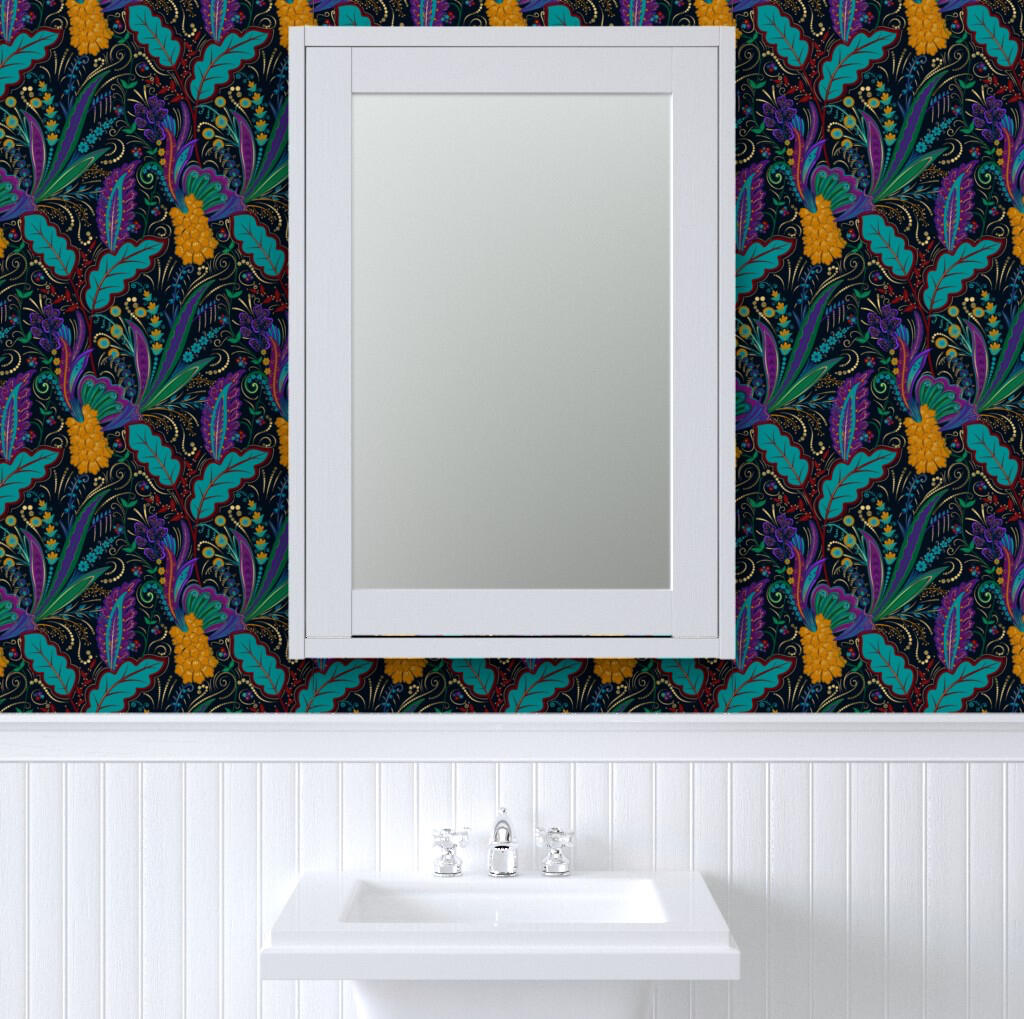 Bathroom vanity with a white framed mirror above beadboard walls, featuring dramatic black wallpaper with teal and purple botanical leaves and golden floral accents.