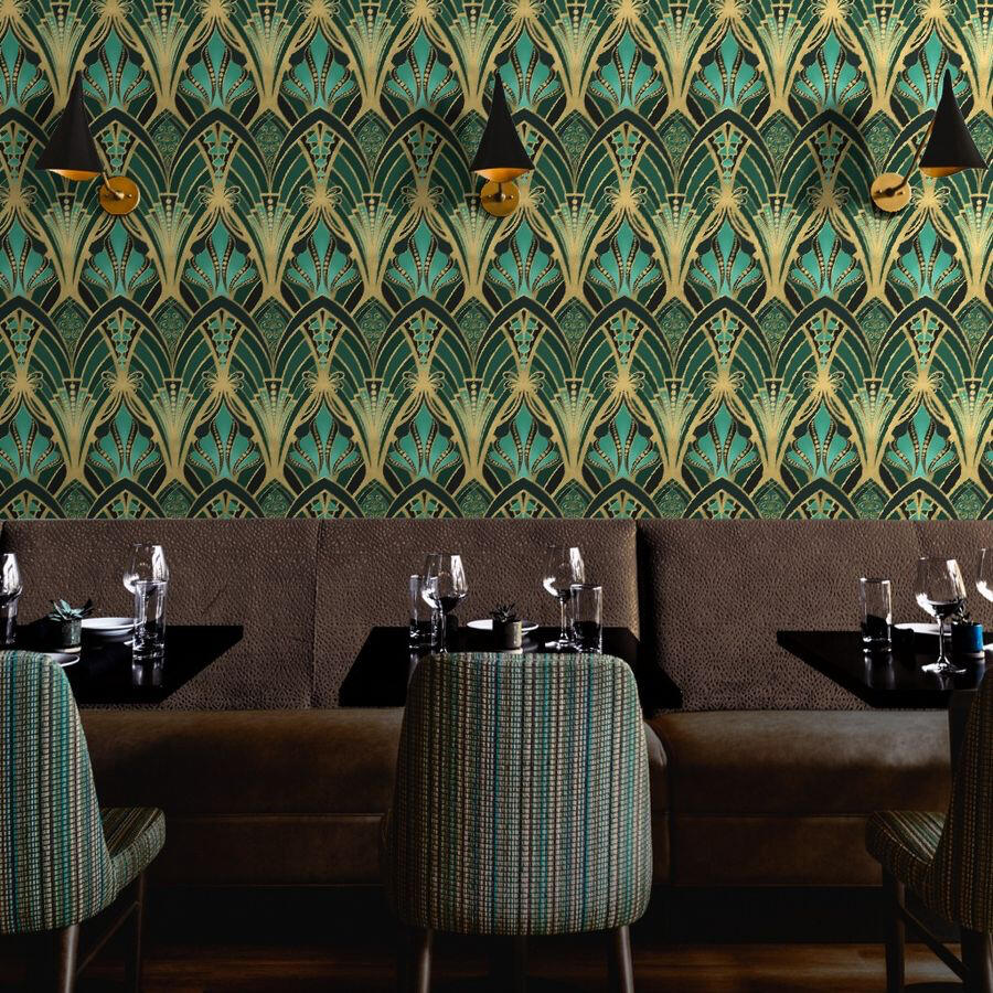 Untitled Restaurant dining booth accented with glamorous Art Deco wallpaper in gold, teal, and dark green geometric patterns.