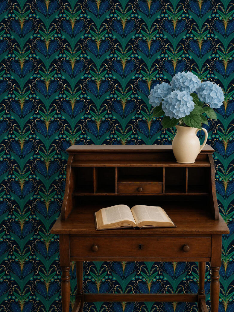 Untitled Vintage-inspired Art Deco wallpaper in rich teal and navy behind a wooden writing desk decorated with blue hydrangeas and an open book.