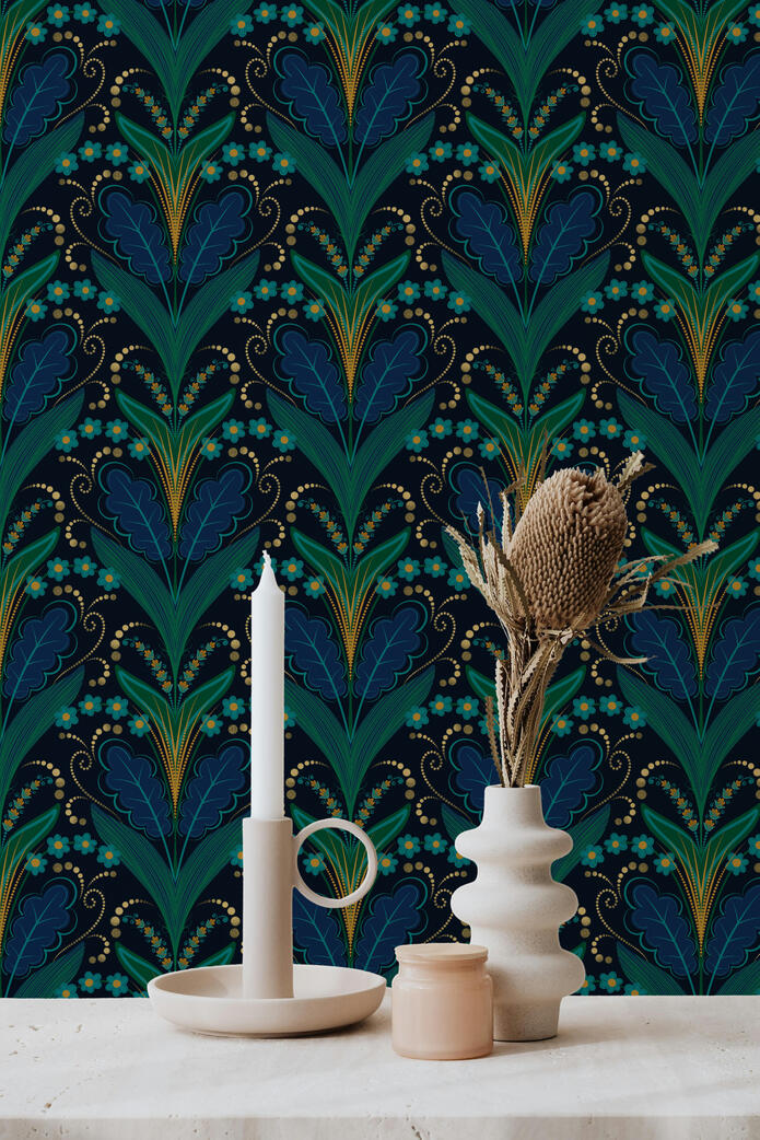 Close-up of a luxurious Art Deco wallpaper featuring stylized blue and teal botanical fans with delicate gold dotted accents on a dark background.
